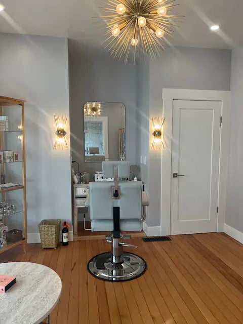 Elegant spa treatment room designed for brow shaping services and personalized facial refinement