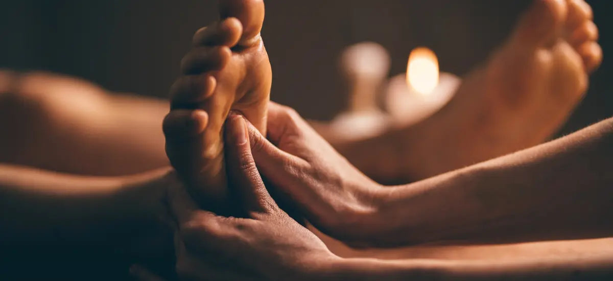 Reflexology foot and lower leg massage using pressure points to improve circulation and whole-body balance